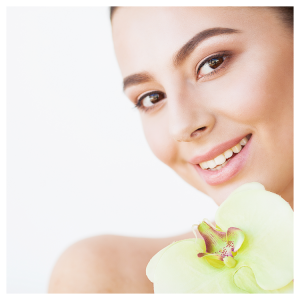 skin-care-beautiful-model-woman-with-perfect-skin-orchid-flower-near-her-face@2x